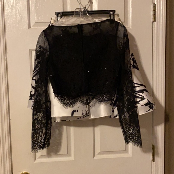 Black and white hoco dress. Worn twice. Bottom is a little dirty not noticeable. - Picture 4 of 4